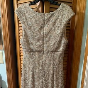 Women’s Ryan Michelle knee length beige dress, with lacy sequined overlay.